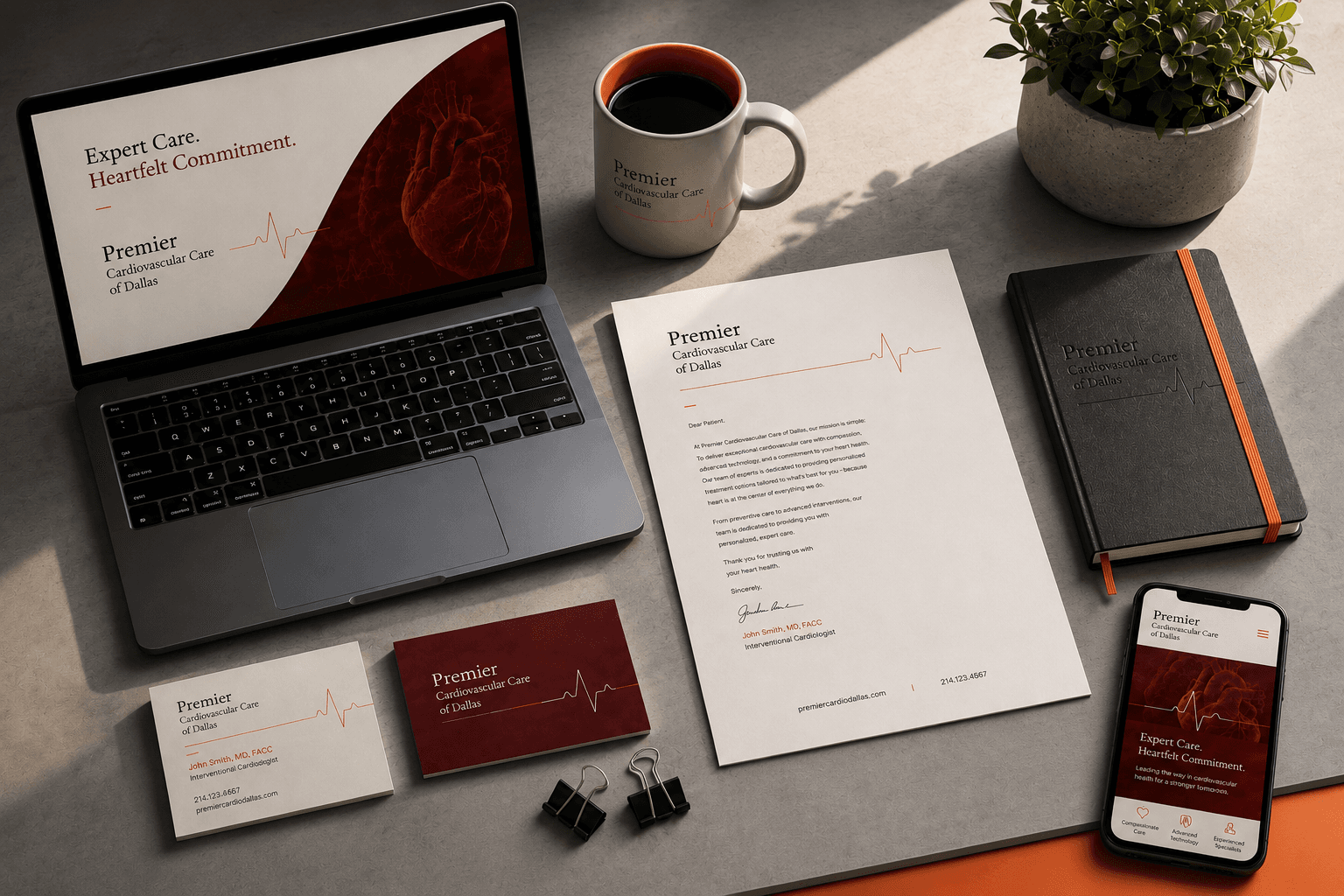 Branded office flat lay with laptop, notebook, business cards, and stationery